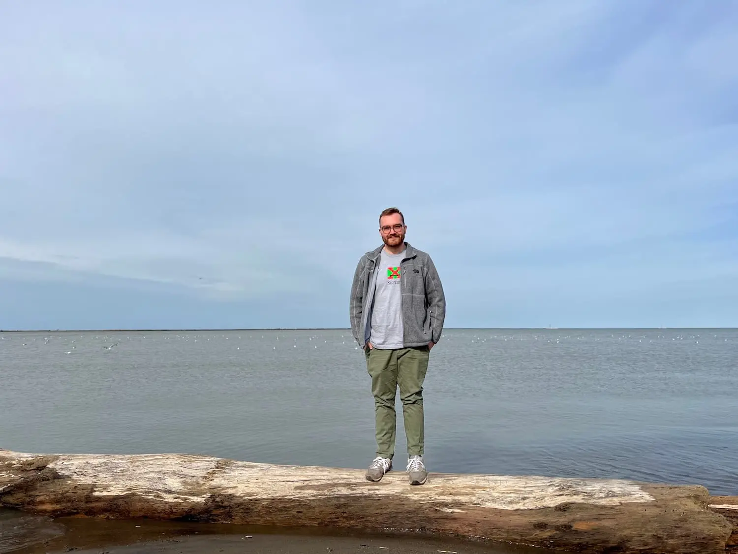 Me standing on a log in Lake Erie