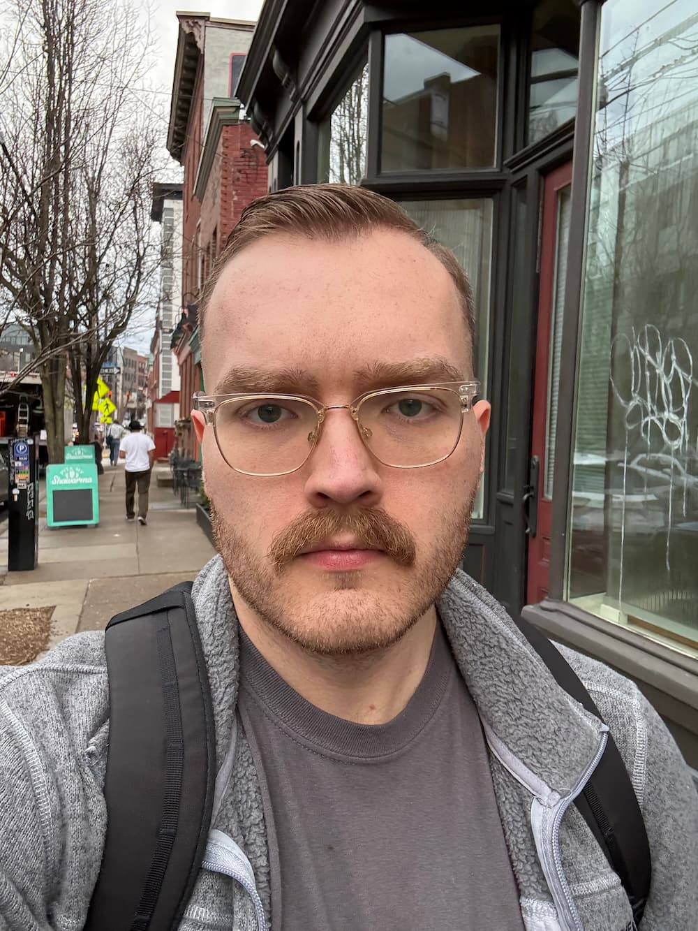 Selfie walking down sidewalk